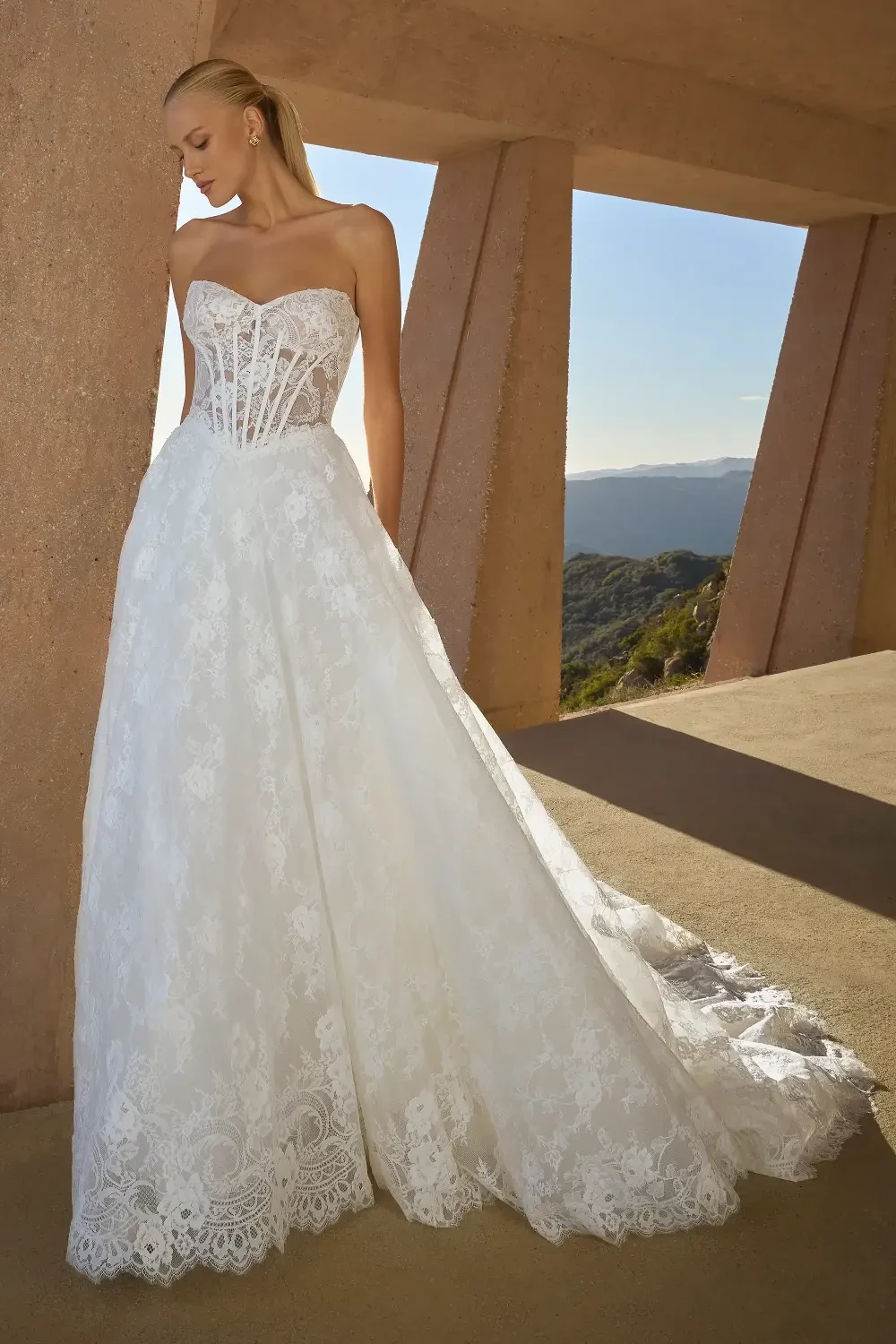 model is wearing a strapless a-line wedding dress