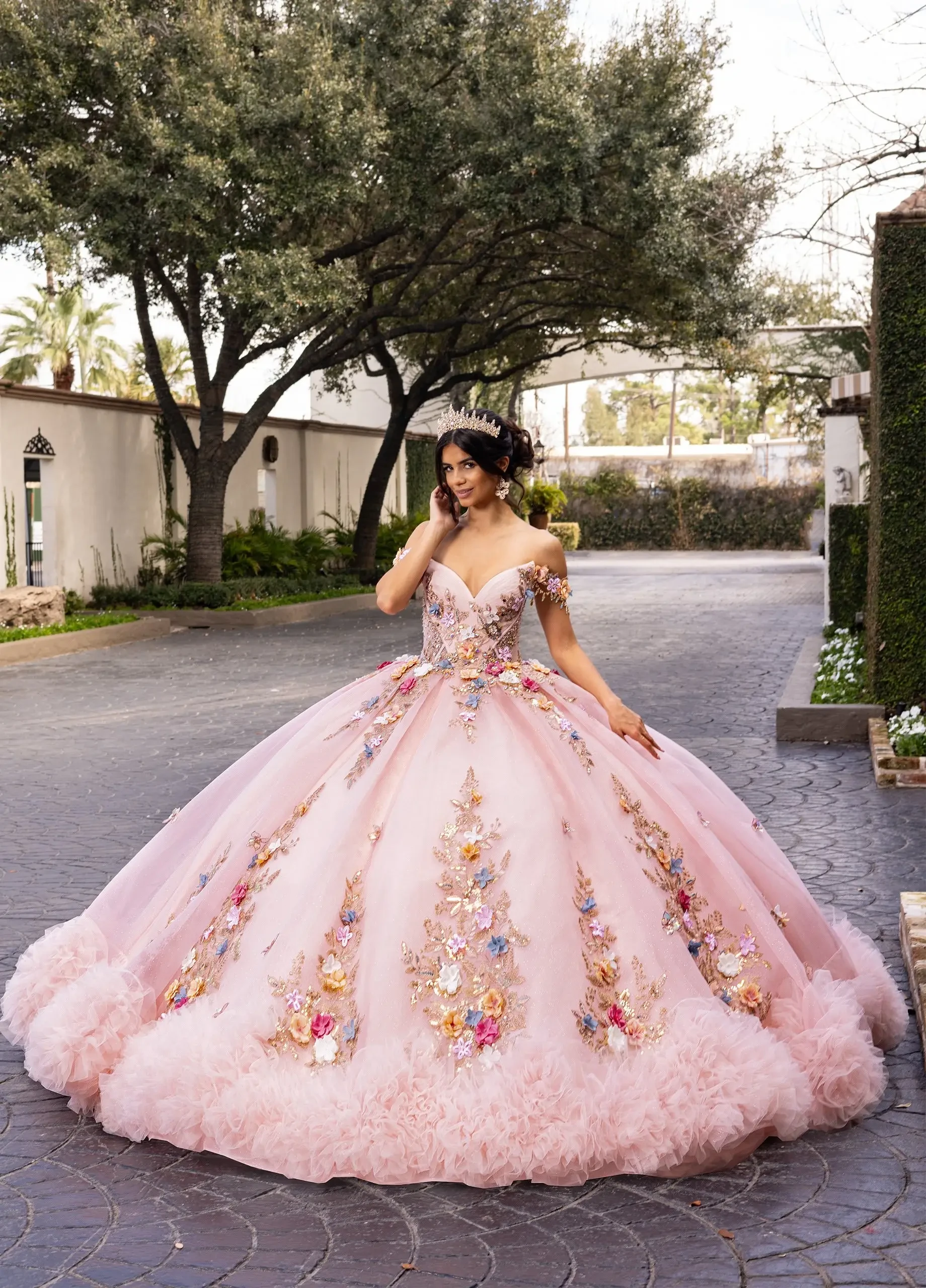 Pink floral ballgown quinceañera dress with crown.