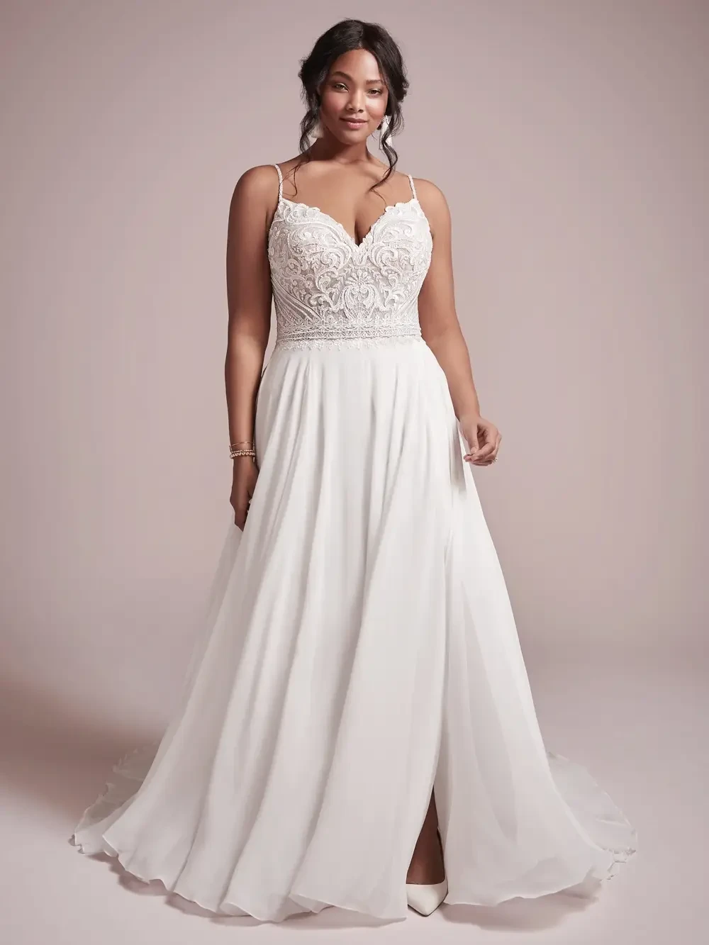 model is wearing a sleeveless a-line bridal gown