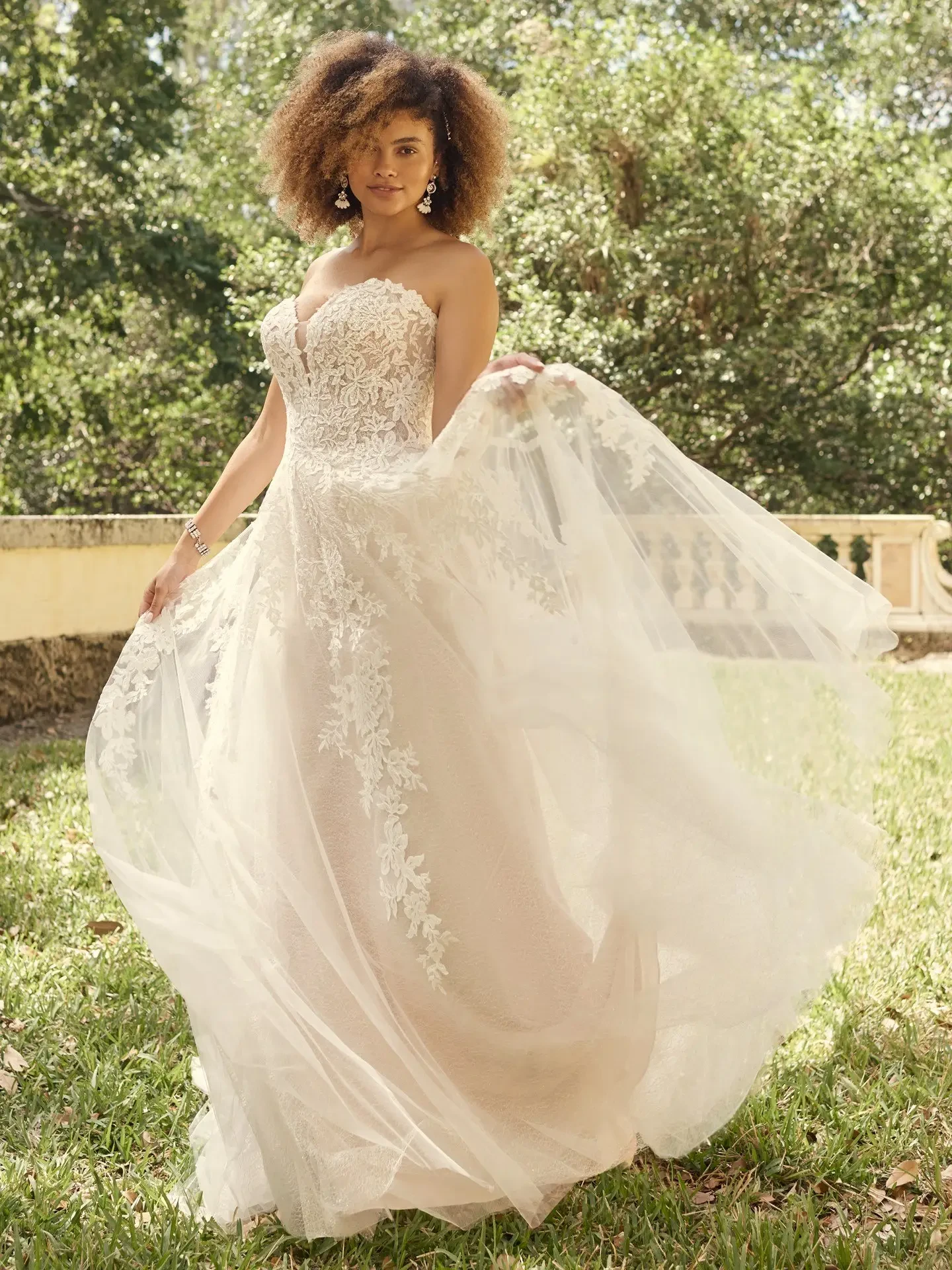 model is wearing a strapless a-line bridal gown